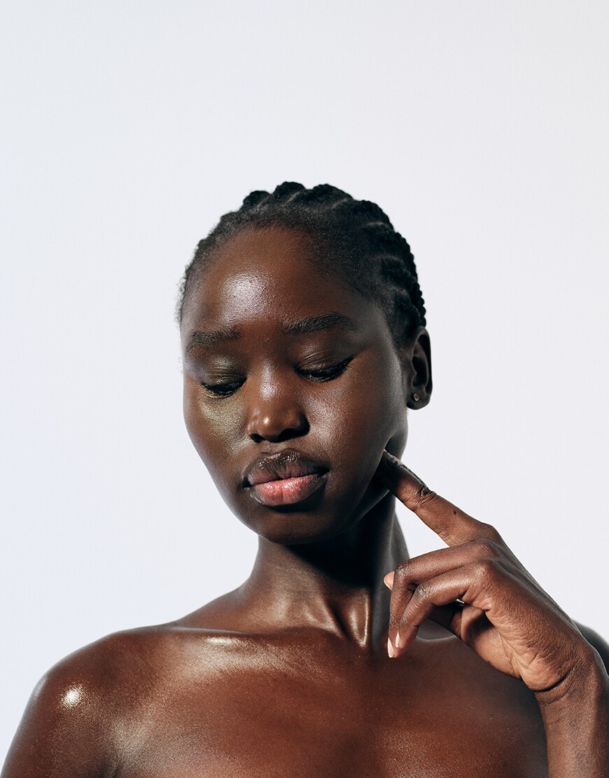 Woman plumping her skin