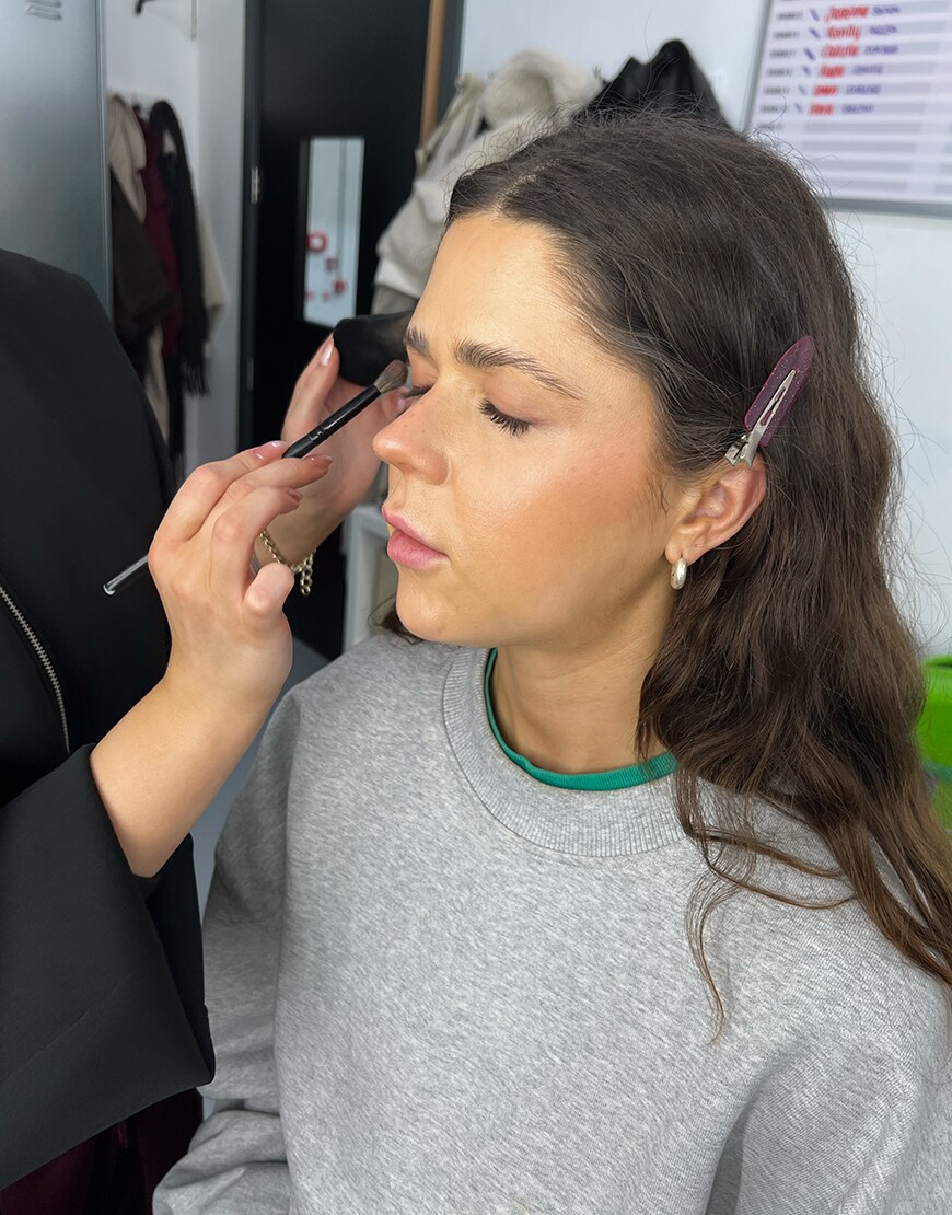 Woman having her makeup done