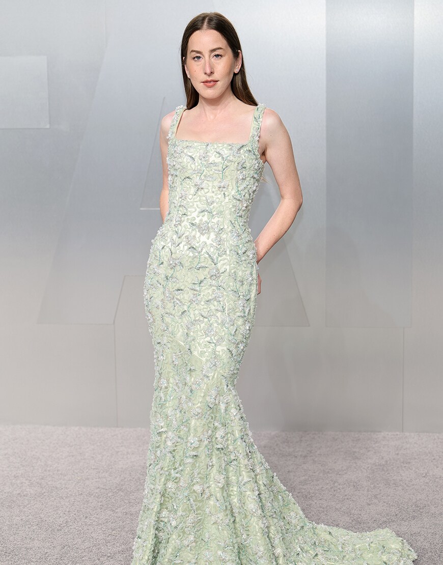 Woman wearing an embellished green dress