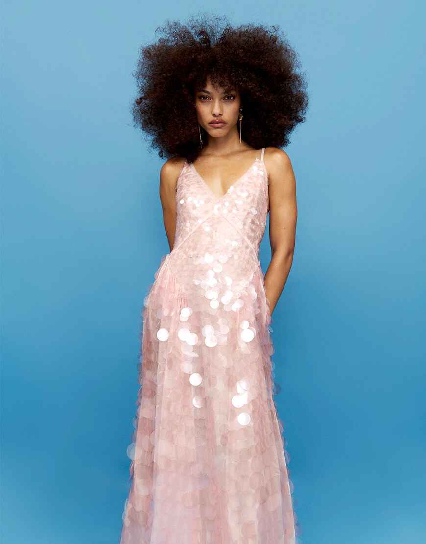 Woman wearing a pink sequinned dress