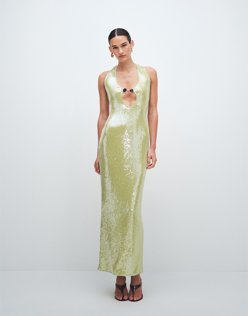 Woman wearing a green maxi dress