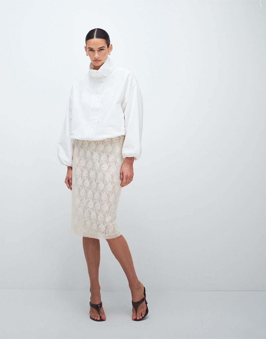 Woman wearing a neutral outfit