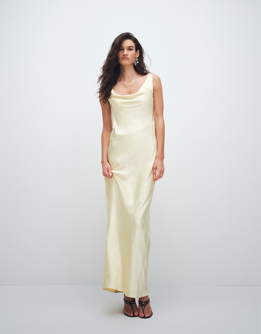 Woman wearing a yellow maxi dress