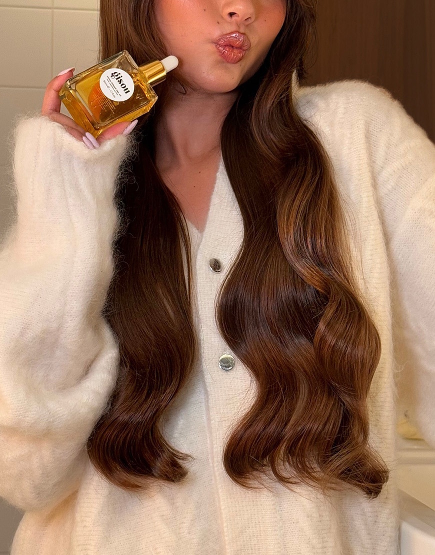 Woman wearing Gisou Honey Infused Hair Oil | ASOS Style Feed