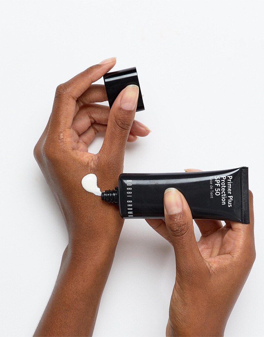 Bobbi Brown primer being applied on a hand