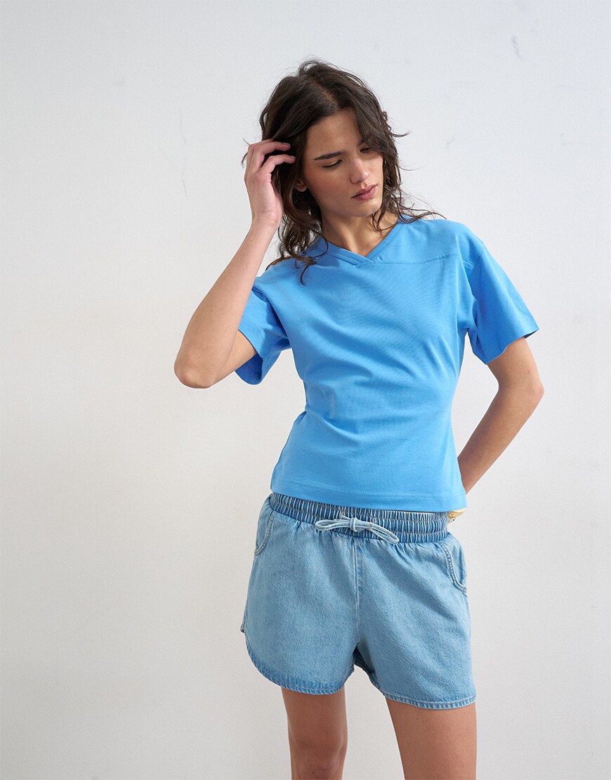 model wearing Topshop v-neck cinch in blue|ASOS Style Feed
