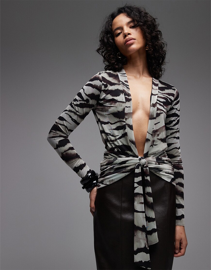 model wearing ASOS DESIGN mesh long sleeve plunge top with tie waist in animal print|ASOS Style Feed