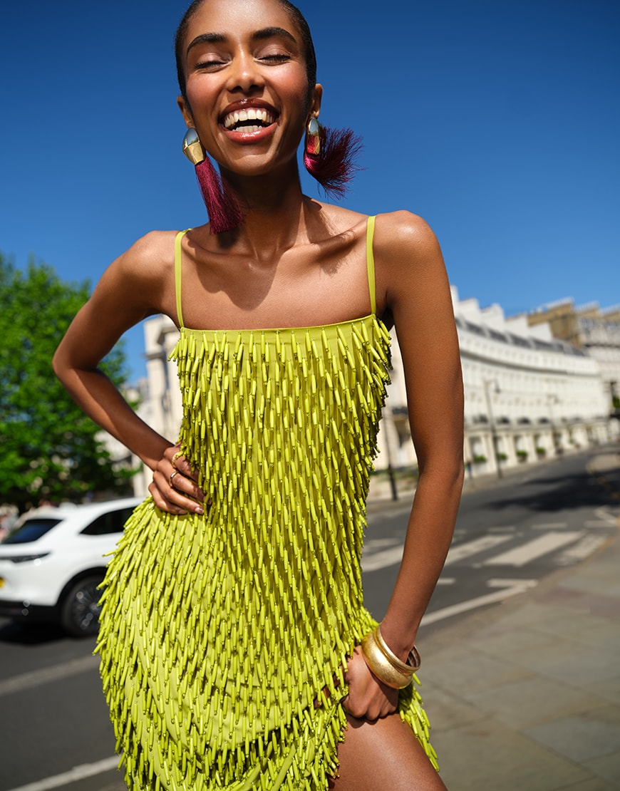 Woman wearing textured green mini dress in London | ASOS Style Feed
