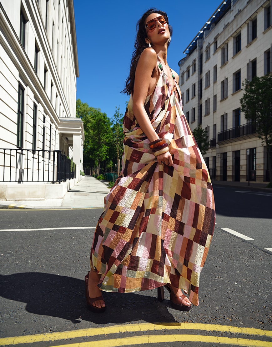 Woman wearing colourful patterned summer dress in London | ASOS Style Feed
