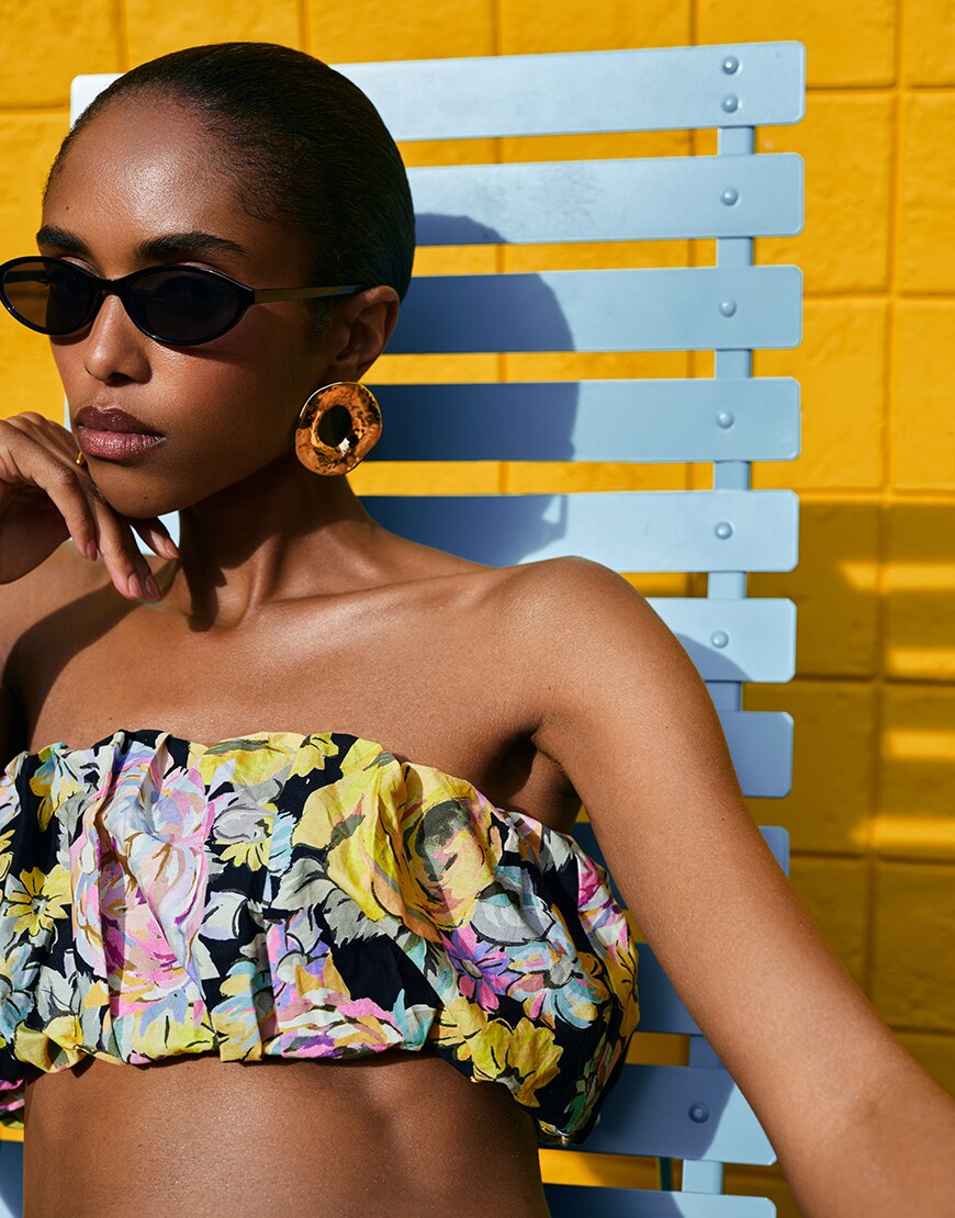 Woman wearing sunglasses and floral crop top | ASOS Style Feed