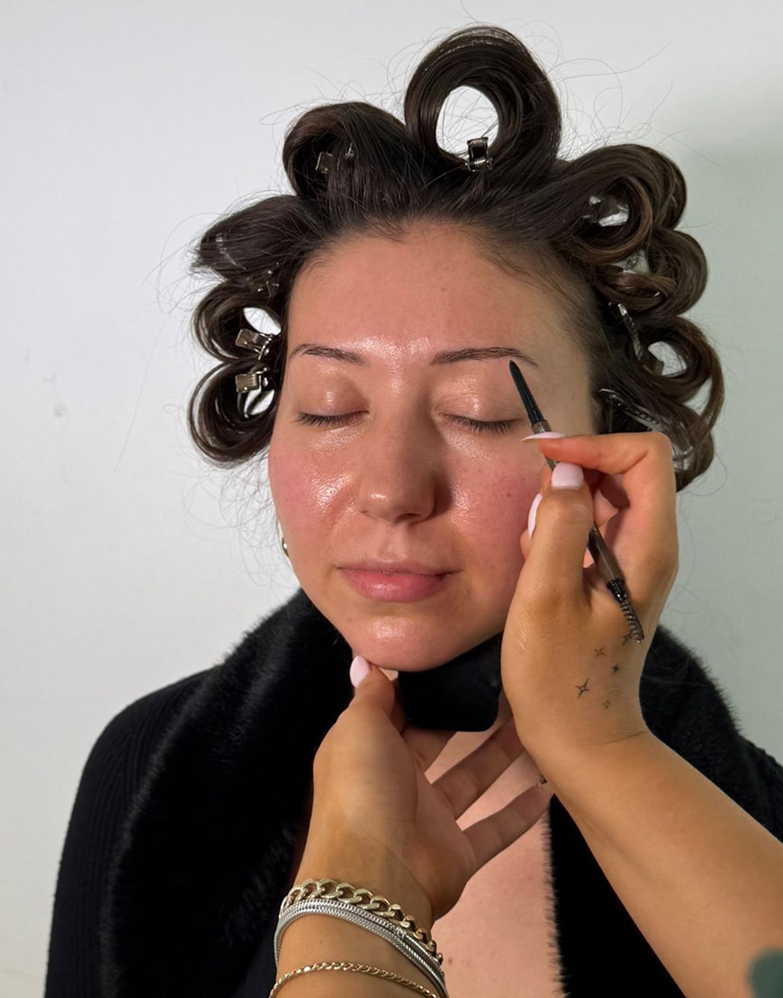 Woman applying eyebrow pencil | ASOS Style Feed