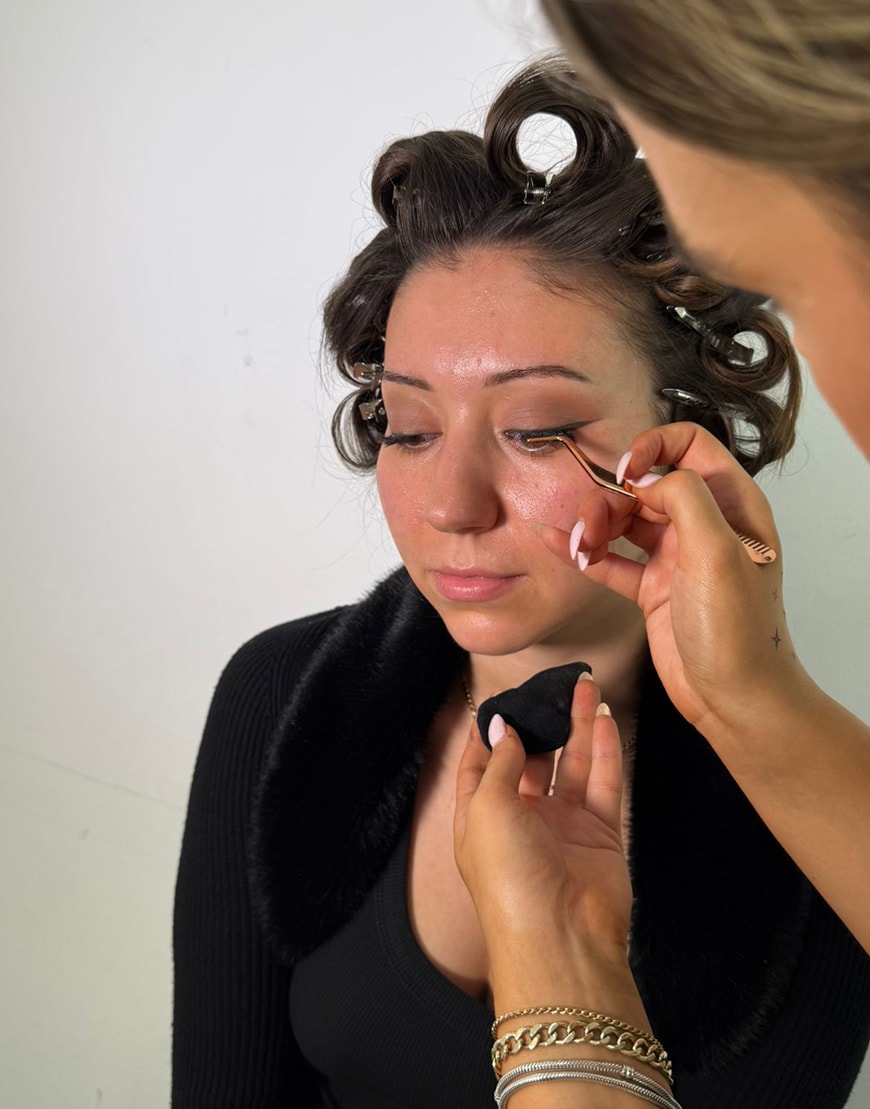Woman applying false eyelashes | ASOS Style Feed