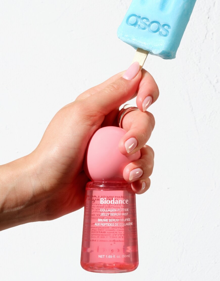 Woman holding a BIODANCE Jelly Mist and an ice lolly