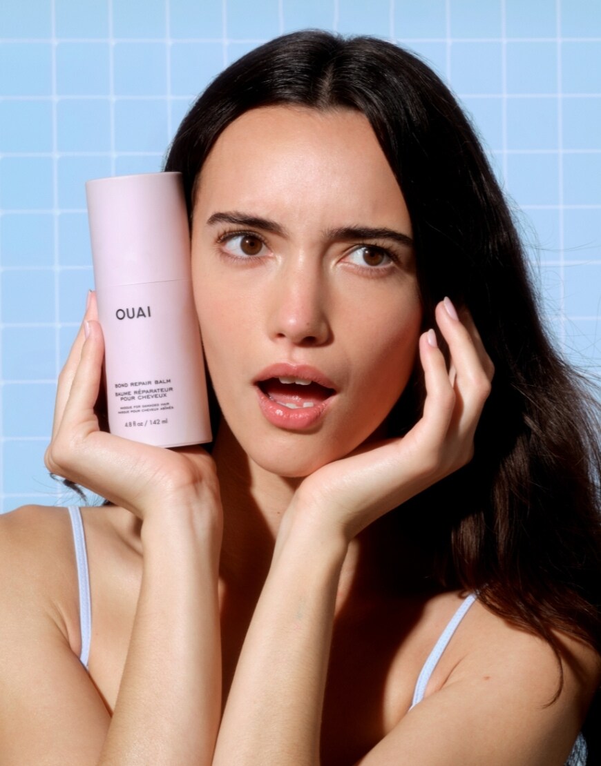 Woman posing with OUAI