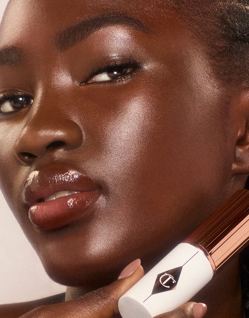 Woman wearing Charlotte Tilbury Unreal Foundation | ASOS Style Feed