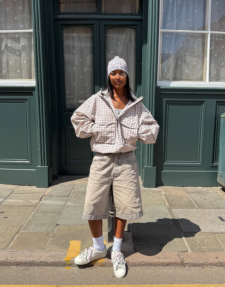 Woman wearing a neutral outfit