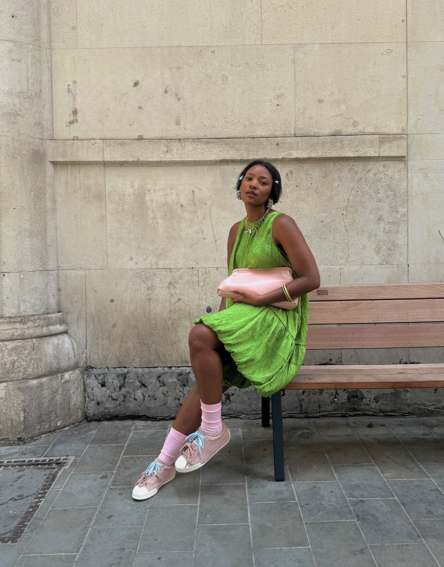 Woman wearing pink Converse trainers