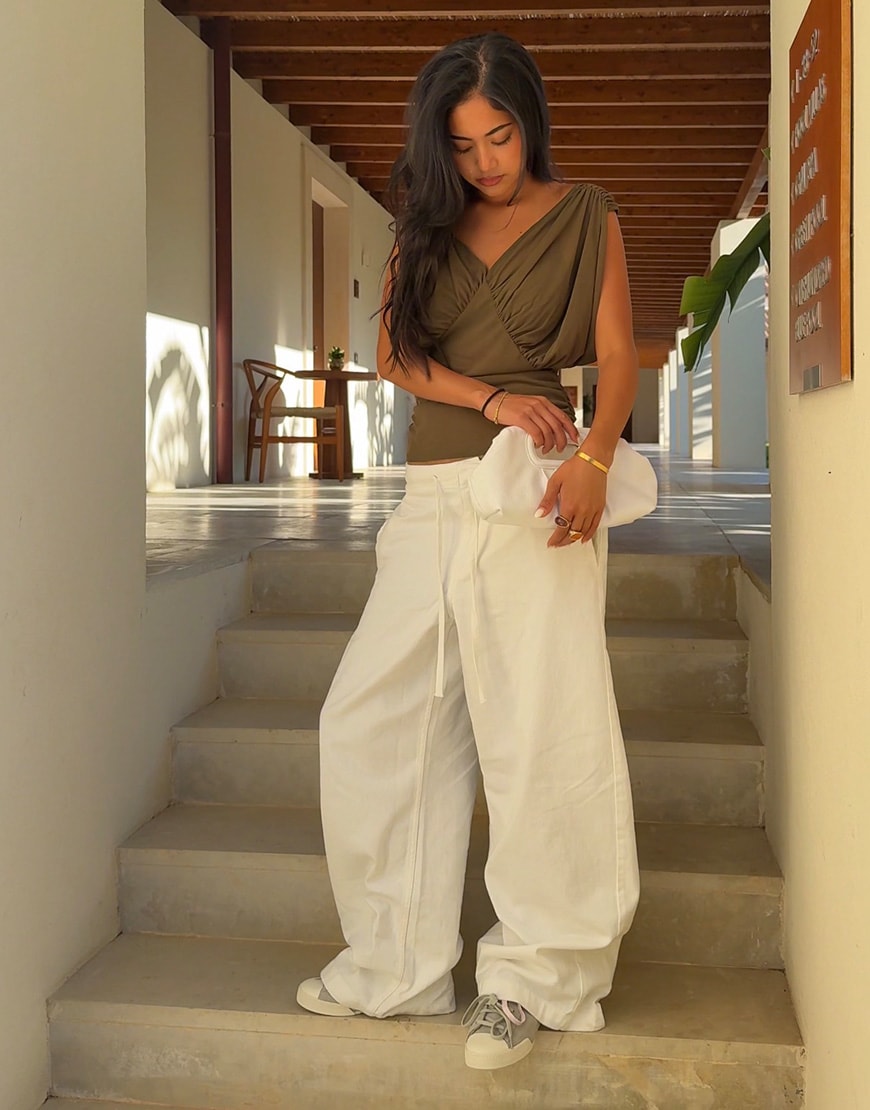 @taesroy wearing green top and white trousers | ASOS Style Feed