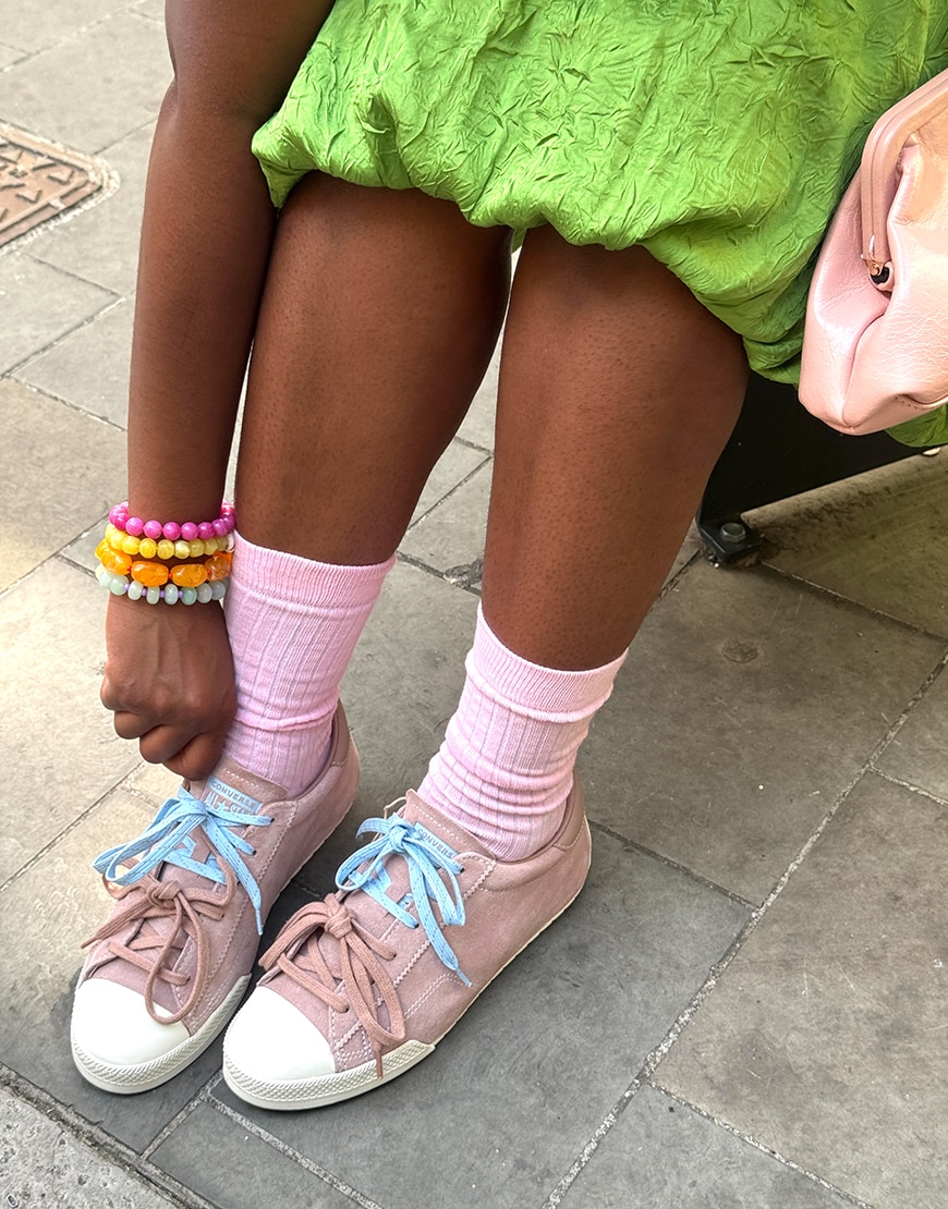 Woman wearing Converse trainers