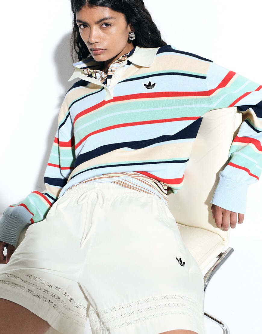 Woman wearing striped adidas rugby top | ASOS Style Feed