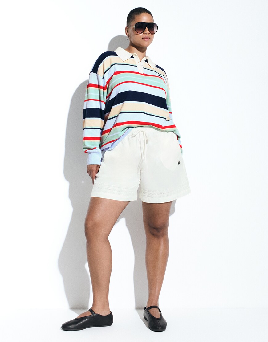 Woman wearing striped adidas rugby top | ASOS Style Feed