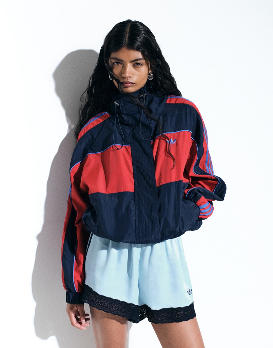 Woman wearing red and black adidas track jacket | ASOS Style Feed