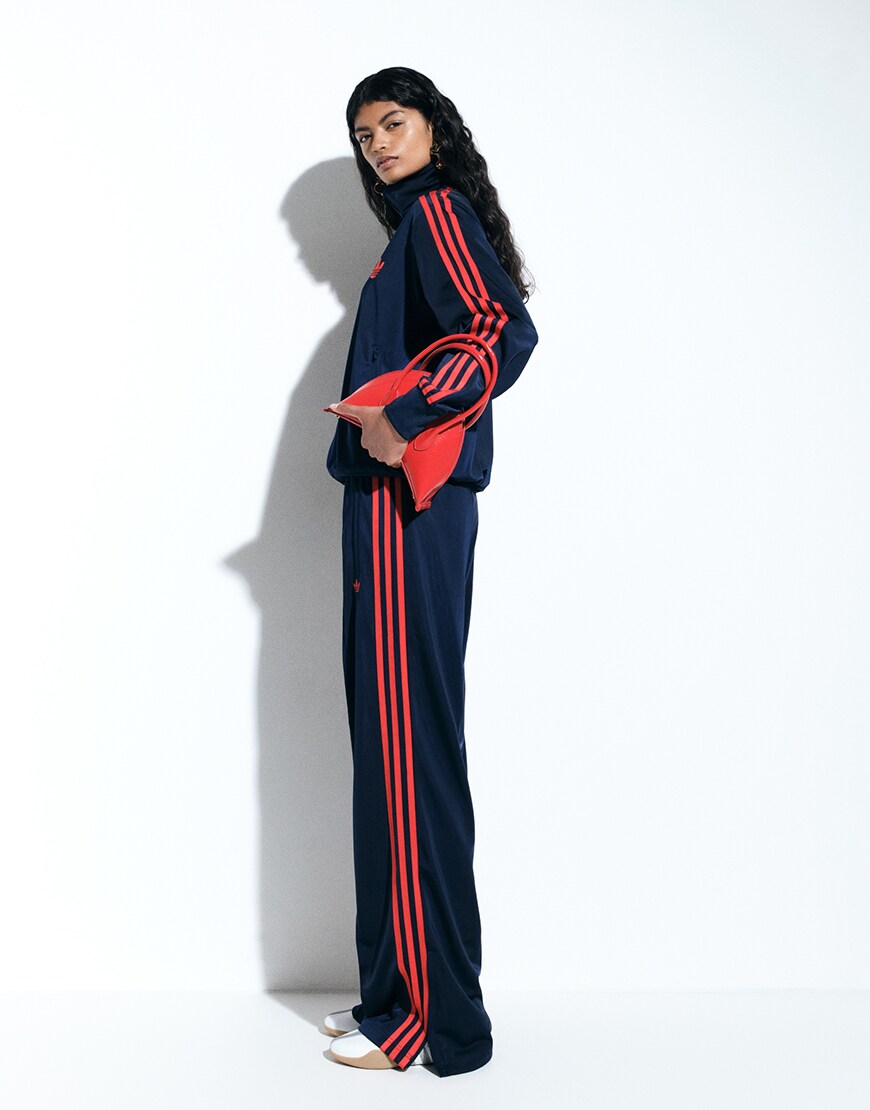 Woman wearing black and red adidas tracksuit | ASOS Style Feed