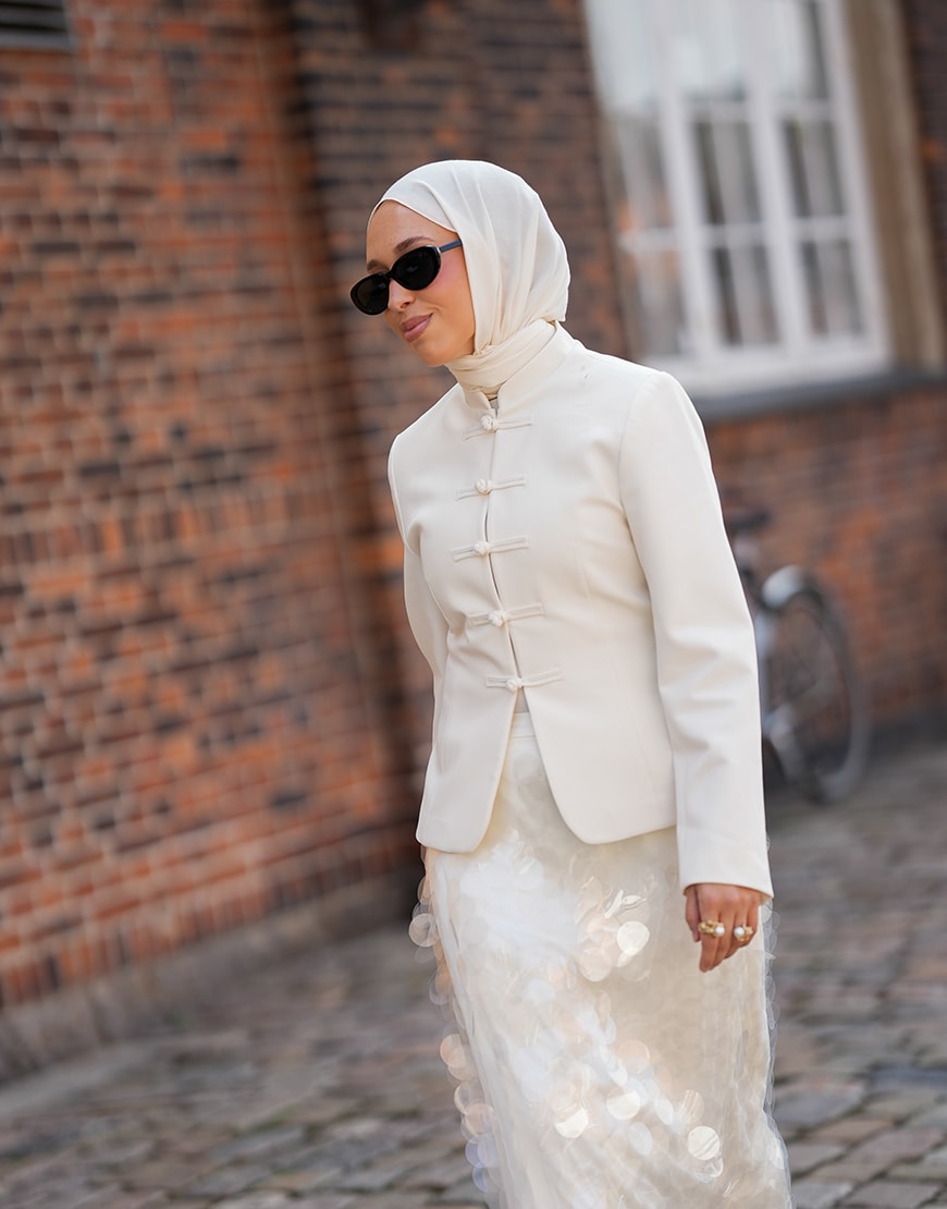 Woman wearing white jacket and skirt | ASOS Style Feed