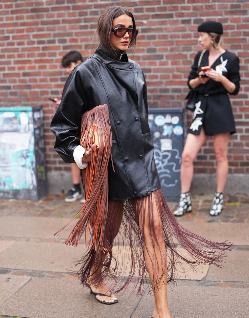 Woman wearing leather jacket and fringe skirt | ASOS Style Feed